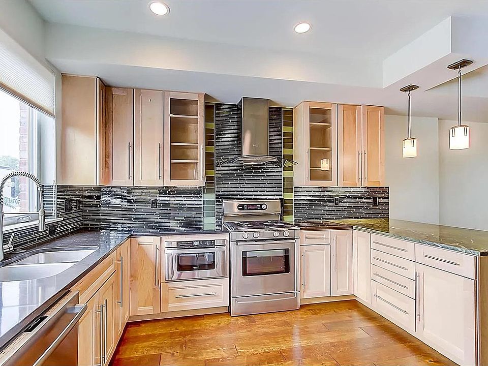 Beautiful open-concept kitchen with large island, stainless steel Bosch appliances and lots of storage