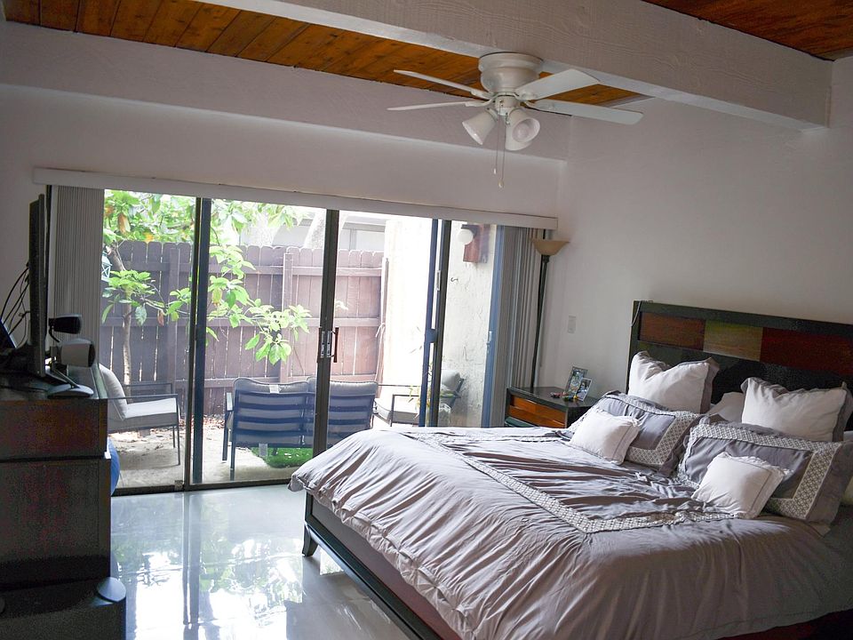 Master with walk-in closets and attached bathroom with a private patio.