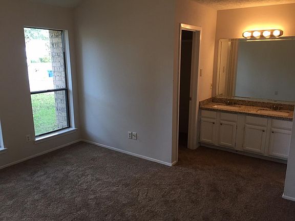Master Bedroom with new carpet, fresh paint and upgraded bat