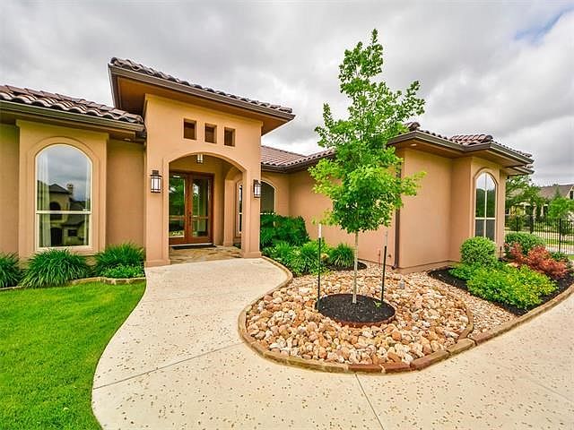 Salt finish on the sidewalk leads the way to the double glass front doors!
