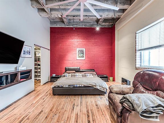 True open, spacious loft in heart of Downtown. Reminiscent of a New York warehouse style loft. This home features reclaimed maple hardwood floors, high exposed cement ceilings, and brick walls.. A great value for Downtown living.