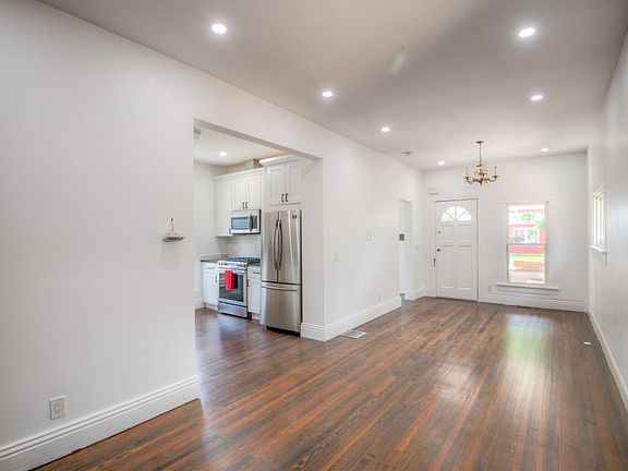 View into kitchen from opening between living room and dining room.