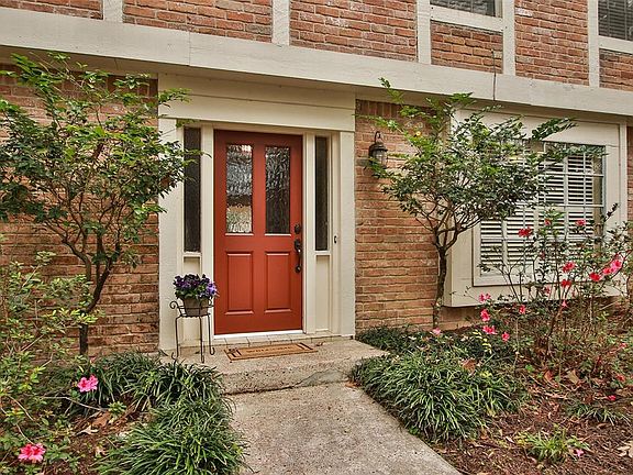Welcoming front porch has updated door & hardware.