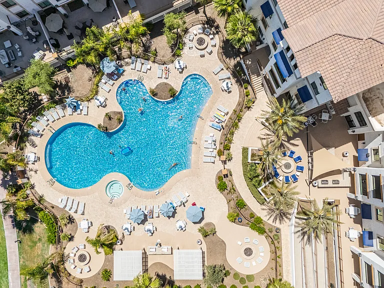 Resort-style pool, spa, poolside lounge areas, multiple fire pits and grills.