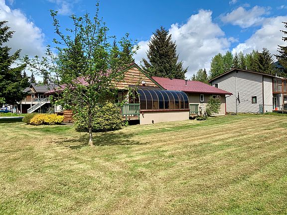 Large back yard and sun room