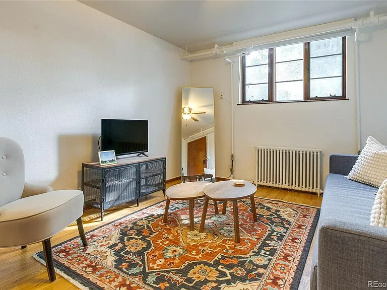 Staged living room without curtains.