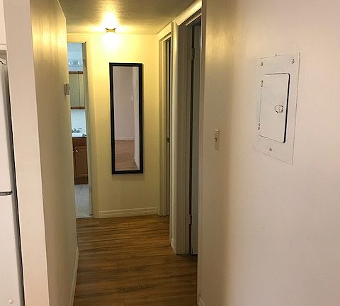 Hall to BRs, bath, laundry 