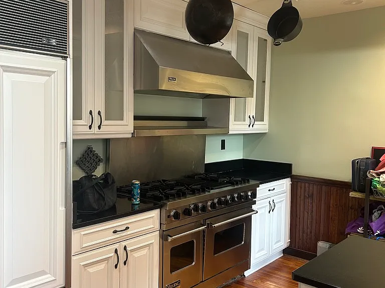 View of Viking stove and cabinet
