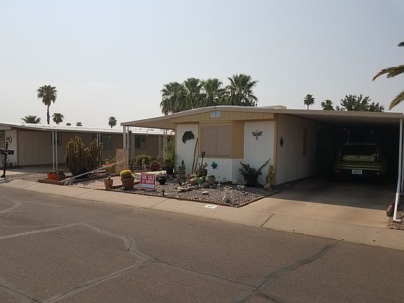 front w/carport and garage