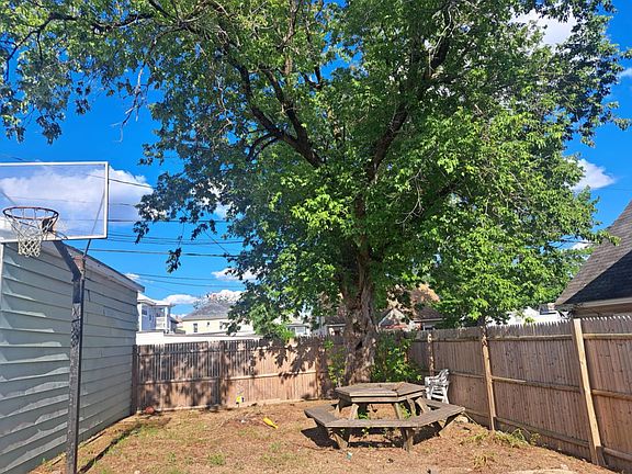 Picnic area, yard, and basketball hoop