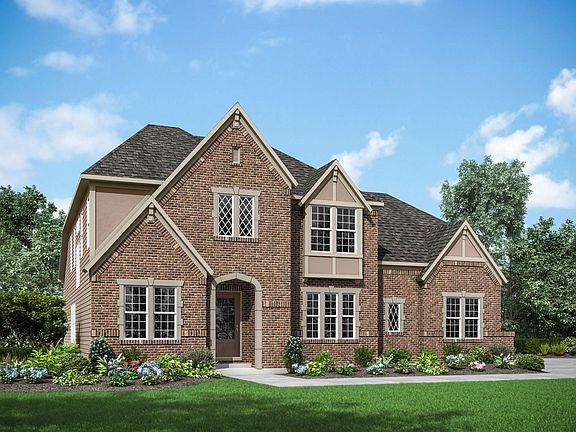 custom home with brick and stucco