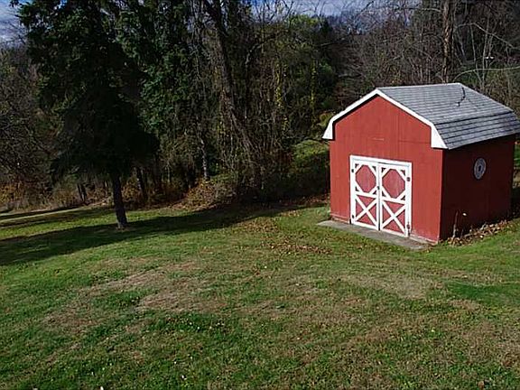 The shed provides plenty of storage for lawn and garden equipment.