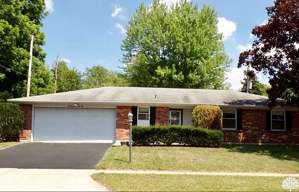 Front with newly paved drive