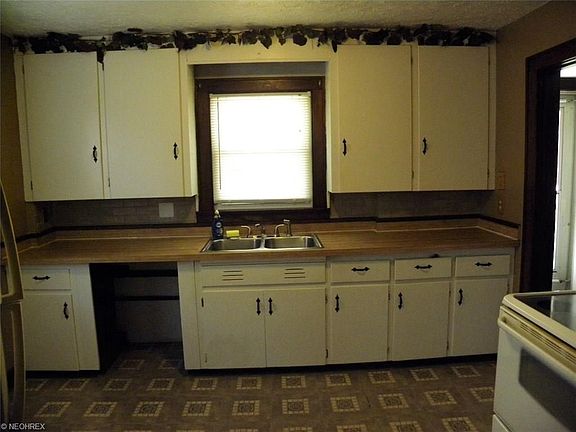 View 2 of the kitchen - hole in cabinetry set for a dishwasher