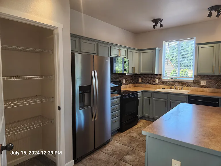 Kitchen with pantry & stainless steel appliances