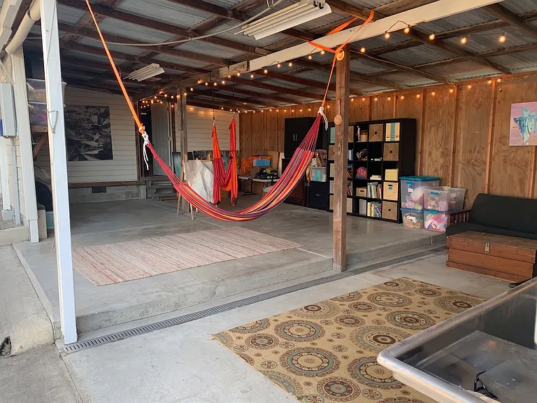 Play area in large section adjacent to two car garage with EV Outlet. Area has working sink as well.