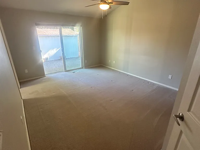 Primary Bedroom with sliding glass doors to outside