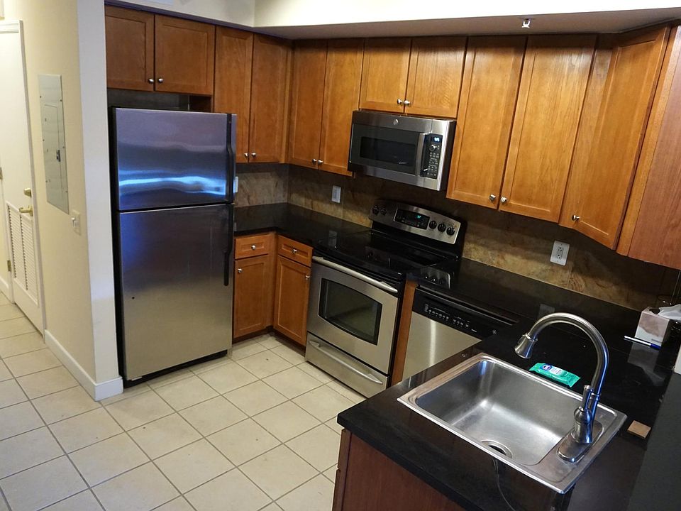 Open kitchen with stainless steel appliances