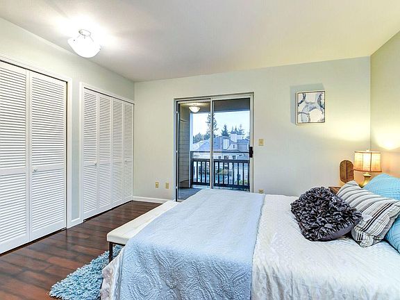 Master bedroom w/hard surface flooring and private deck.