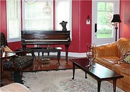 gorgeous, deep front room - wood burning fireplace - perfect for entertaining.