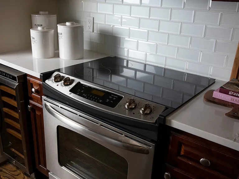 Stainless Steel Appliances including Self-Cleaning Oven with Glass Cooktop and Wine Chiller