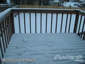 Deck and stairs to large fenced backyard