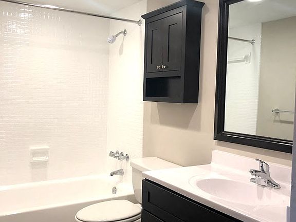 Renovated Style Bathroom with linen closet and modern finishes