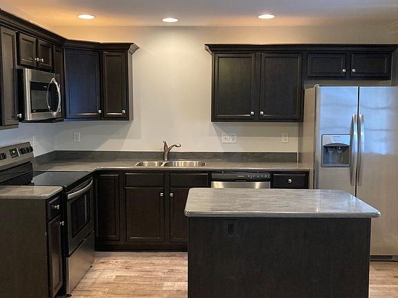 Open floor plan kitchen, living area & dining area