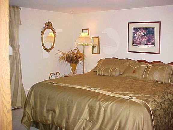 Master bedroom with 3/4 bath & walk-in closet.