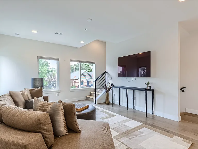 Second floor living room with 9 ft ceilings featuring Sony OLED SmarTV