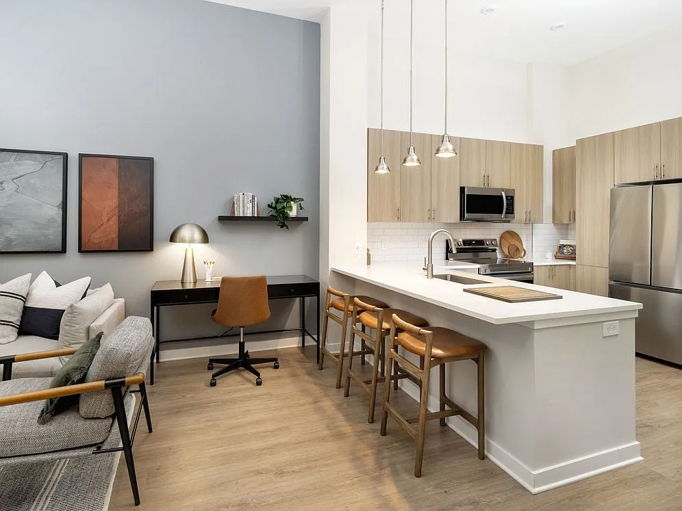 Kitchen and dining area with hard surface vinyl plank flooring - Avalon Durham
