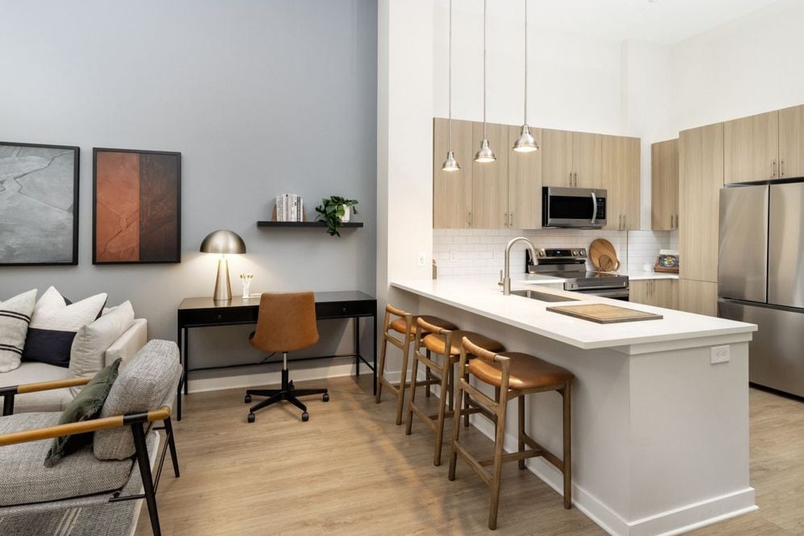 Kitchen and dining area with hard surface vinyl plank flooring
