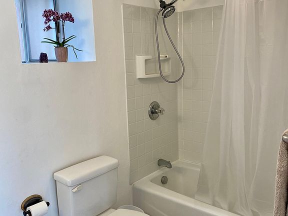 Large bathroom tub and shower.