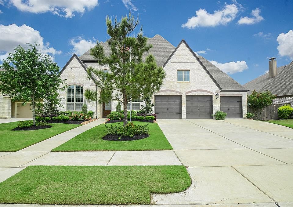 This home has a 4-car tandem garage to easily store your 4 favorite prized possessions from trucks to sedans. This extra wide & long driveway will also accommodate your guests during special gatherings.
