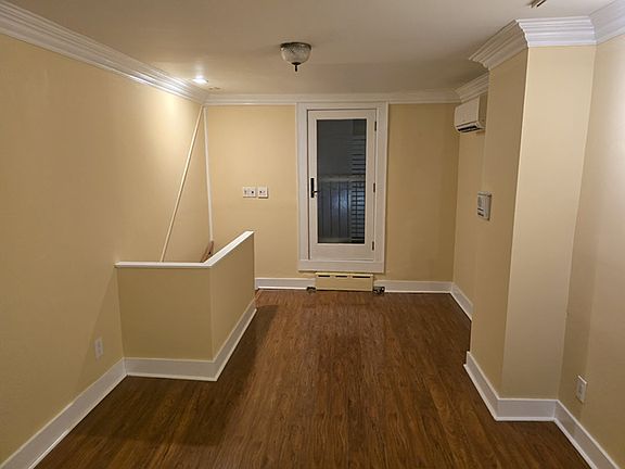 Third floor room facing to back and the deck door