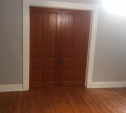 pocket doors separate bedroom from living room