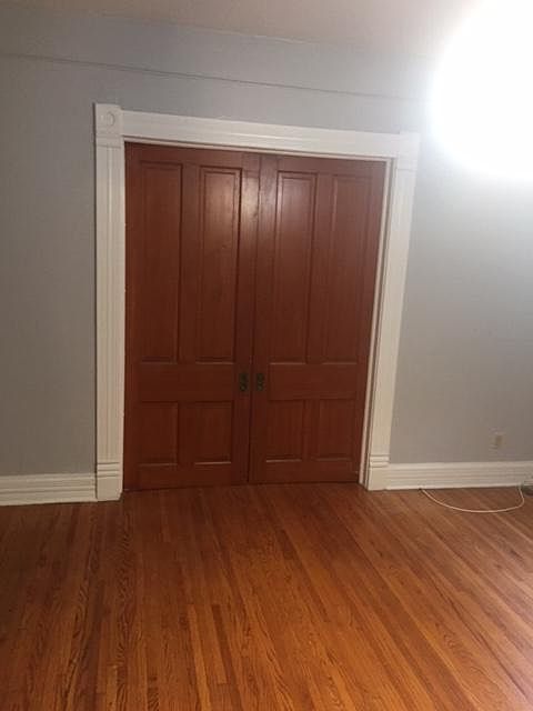 pocket doors separate bedroom from living room