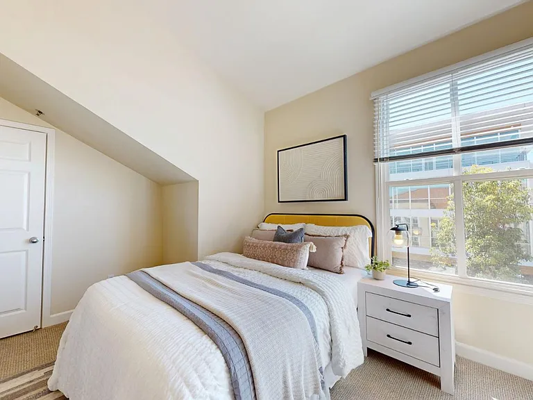 Master bedroom with spacious walk-in closet in the back.
