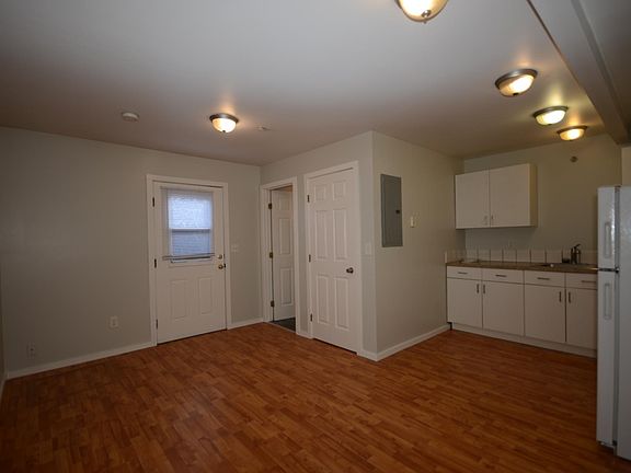 Pretty much the entire unit. From left: Entrance, bathroom door, closet, kitchen.