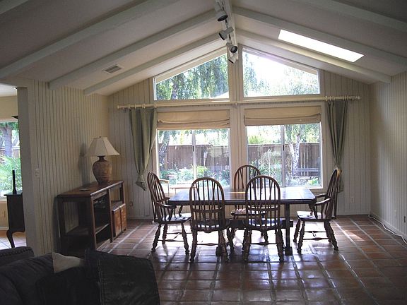 Large great room with open beamed ceiling