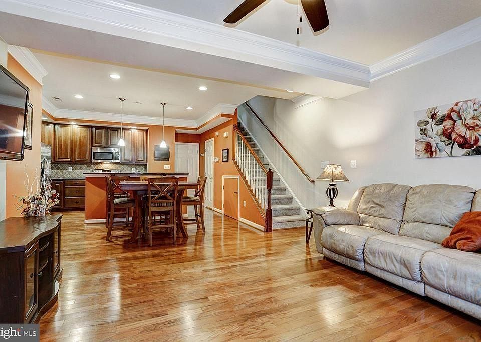 Main level open plan great room with hardwood floors.