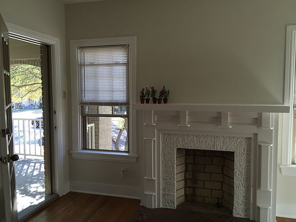 fireplace and open door to porch