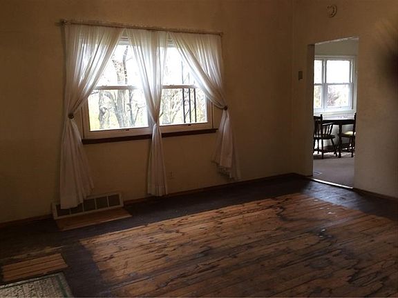 Dining room with newer windows and plenty of natural light.  Adjacent to kitchen.