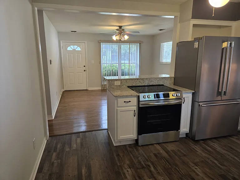 Kitchen looking back into living room