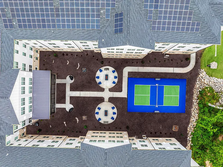 Active Adult birds eye view of courtyard and pickleball courts