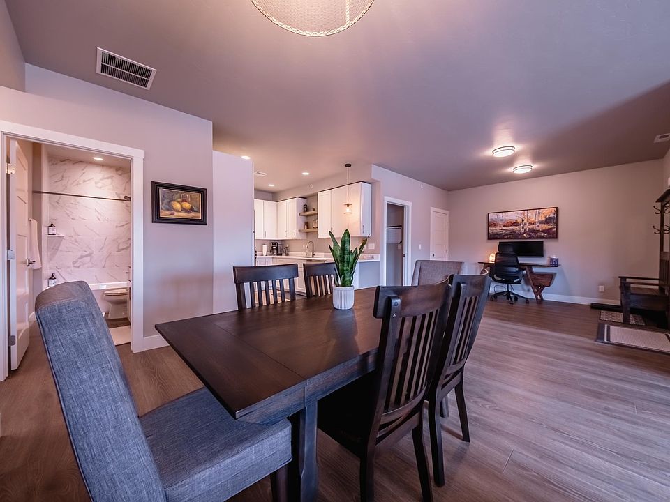 View from Living Room to Dining Space to Office Space to Kitchen Space.