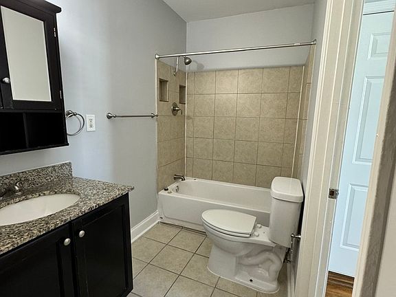 Bathroom with entrance to bedroom and living room