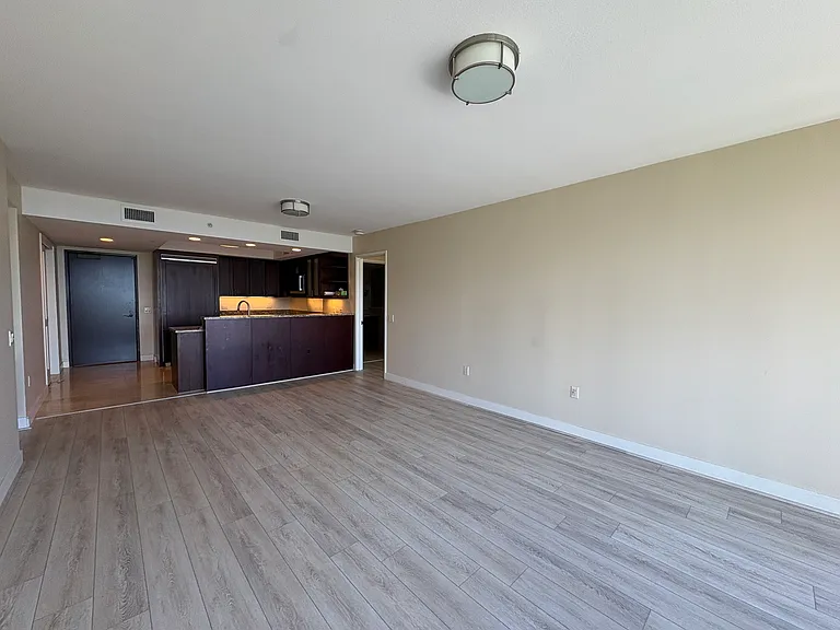 Living room, kitchen and entry from lanai