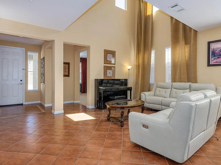 Living Room looking towards the front door. Entrance to the den is visible on the right