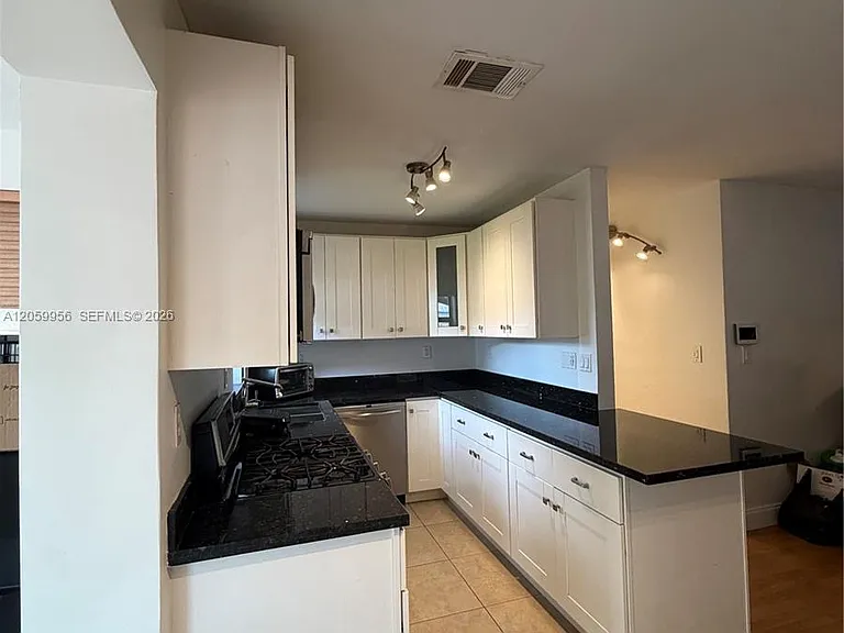 6717 Raleigh St — Photo 10